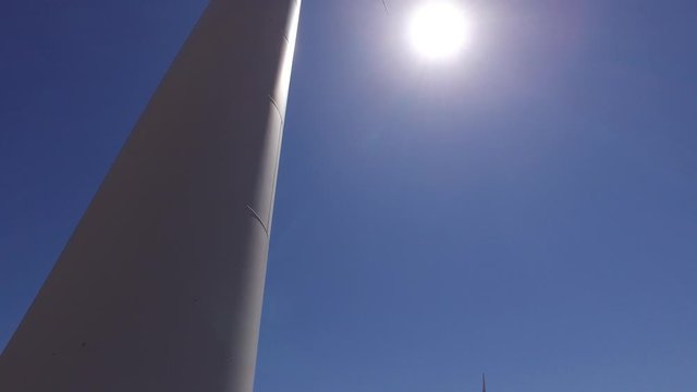 wheat field with eolic turbines wind renewable energy farm 4k