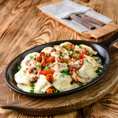 homemade dumplings with forest mushrooms in a pan