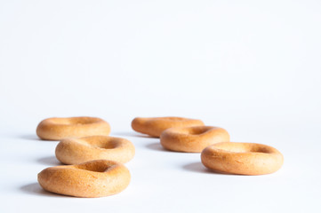 Delicious dried pastries or dry donuts lies on a table on a white background.