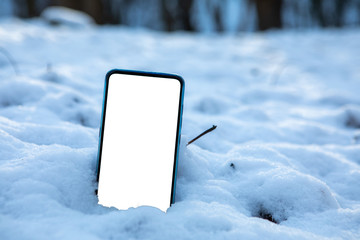 phone in snow white empty screen copy space