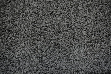 Rough concrete walls painted Gray. The wall surface is rough