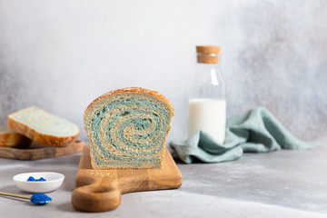 Blue matcha bread with milk and honey. Blue spirulina, superfoods.