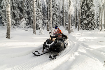 Athlete on a snowmobile.