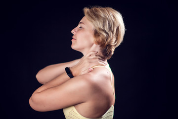 Fototapeta premium Woman feeling strong neck pain. Fitness and healthcare concept