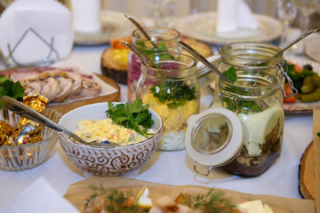 Cold Appetizers with a variety of food on the table. Gorging on calories at a holiday reception.