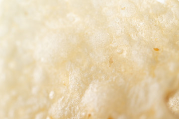 Super close up of a potato chip.