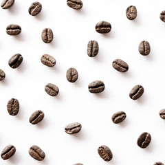 Roasted coffee beans arrange on white background