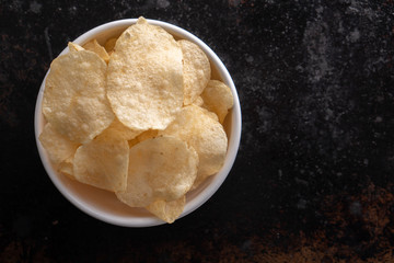 Potato chips heaping in a bowl