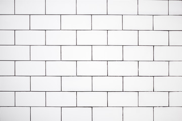 white classic ceramic tiles on the wall in the bathroom, brick tiles, background