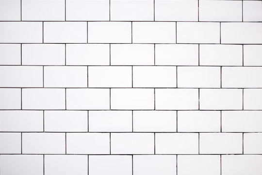 white classic ceramic tiles on the wall in the bathroom, brick tiles, background