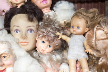 Fototapeta na wymiar Dirty old dolls that have been kept for many years.