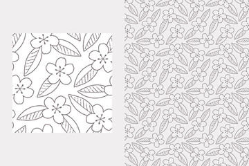 Seamless pattern with cherry blossoms and leaves. A one-color vector pattern with a transparent background. Outlines of hand-drawn cherry flowers and leaves.