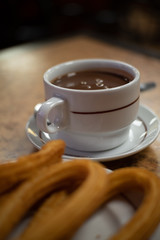 cup of hot chocolate with churros