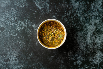 Take Away Indian Dish Spinach Lamb Palak in Plastic Box Package / Container.