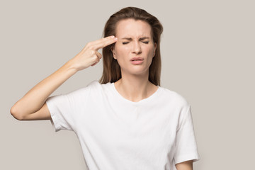 Stressed woman put imaginary gun to head having problems