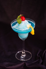 Frappe blue hawaii cold smoothie drink.Black background