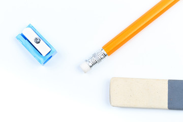 A sharpener, eraser and yellow pencil isolated on a white  background - Image