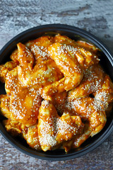 Raw chicken wings marinated in sesame sauce.