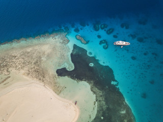 High view of the red sea, the coast and the yacht in Egypt