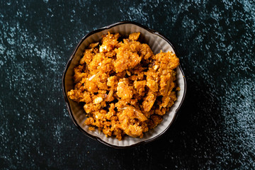Gajar ka halwa / Halva is a carrot-based sweet dessert pudding from India. Garnished with Cashew/almond nuts and Served in a bowl.