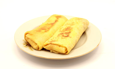 Pancakes with cottage cheese and raisins on a white background