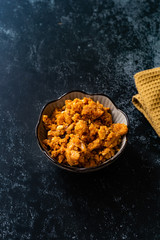 Gajar ka halwa / Halva is a carrot-based sweet dessert pudding from India. Garnished with Cashew/almond nuts and Served in a bowl.