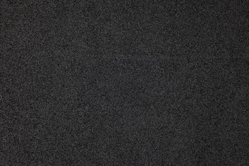 Black foam surface.