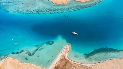 Aerial view of the Red sea in Egypt, boat and kiters
