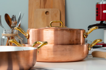 Close up of modern kitchen interior with copper cookware