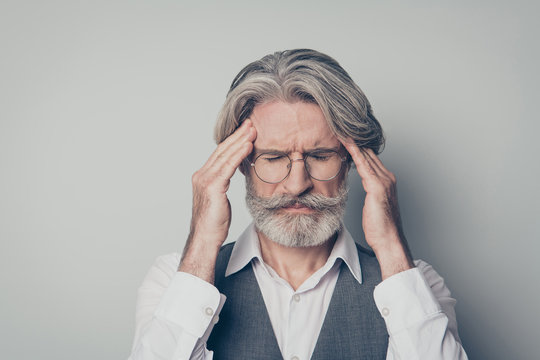 Close up photo of overworked frustrated old man suffer migraine touch hands forehead close eyes wear stylish shirt style vest isolated over grey color background