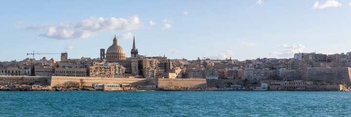 Fototapeta na wymiar Panorama of Valletta, seafront skyline of the capital city of Malta from Sliema shoreline