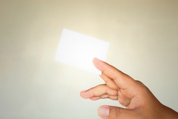 hand holding blank business card