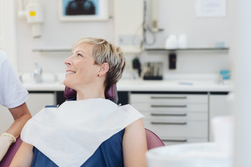 Attractive woman patient in a dental surgery