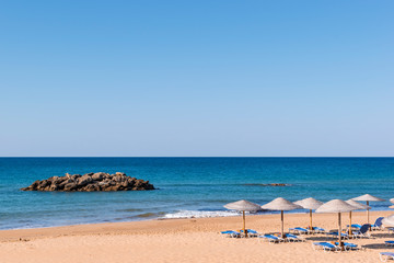 Obraz premium Chalikounas Beach, Corfu Island. View of the deserted, sandy, windy beach on the western part of Corfu. Seascape. Travel and vacation concept.