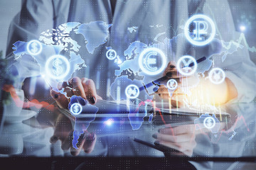 Financial forex graph drawn over hands taking notes background. Concept of research. Double exposure