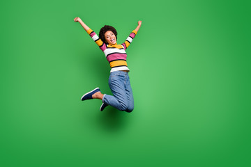 Full size photo of cheerful crazy girl jump celebrate lucky autumn lottery win raise fists scream...