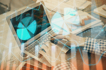 Double exposure of forex graph with man working on computer on background. Concept of market analysis.