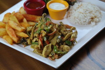 Chicken with Vegetables and French Fries