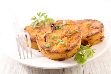 fried polenta  with parsley in plate