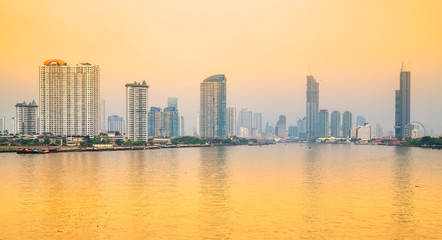 Fototapeta na wymiar Bangkopk skyline, view of the city with reflection on the Chao Praya River, Thailand