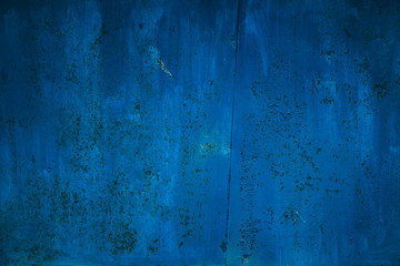 Old rusty metal, texture. Background with blue metal sheet and rust.