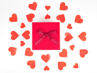 Red gift boxes and red hearts on a white background.