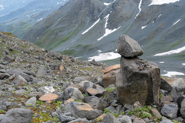 Fototapeta na wymiar Summer mountainous landscape with a boulder.
