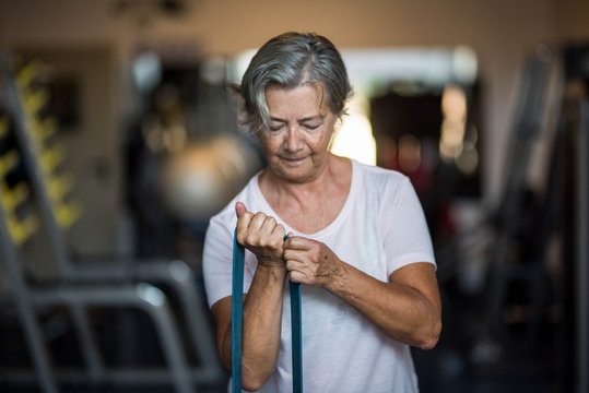 one mature woman doig exercise at the gym to be healthy and fitness senior - training every day lifestyle and concept