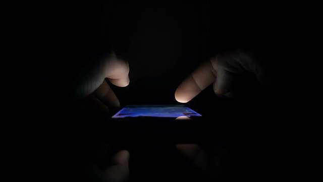 Fingers scrolling web pages on smart mobile phone, vertical view