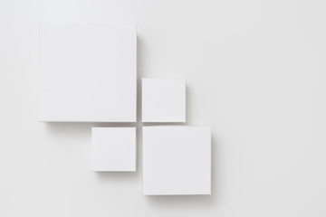 Mock up of four different size white boxes on the white background