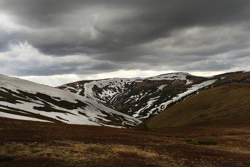 Mountains with the last snow in early spring. Wonderful expanse of mountain landscape and with...