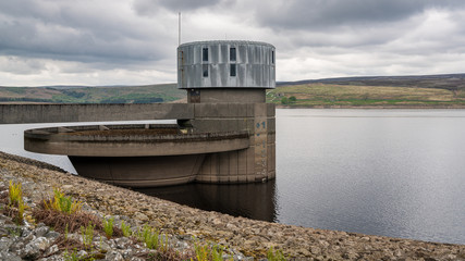 The outlet tower and spillway of the Grimwith Reservoir near Howgill, North Yorkshire, England, UK