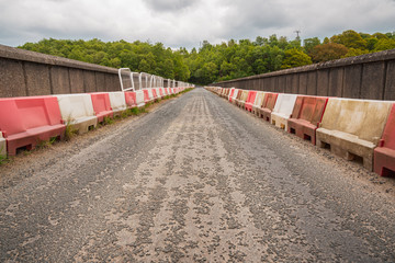 Obraz premium Road over the Washburn dam, leading over the Thruscross Reservoir near Bolton Abbey, North Yorkshire, England, UK