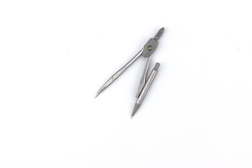 Pen compass placed on a white background for the designer